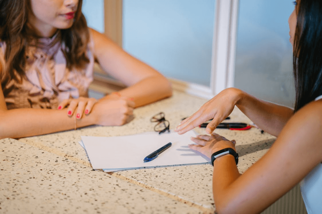 Picture showing a teacher giving feedback to a student