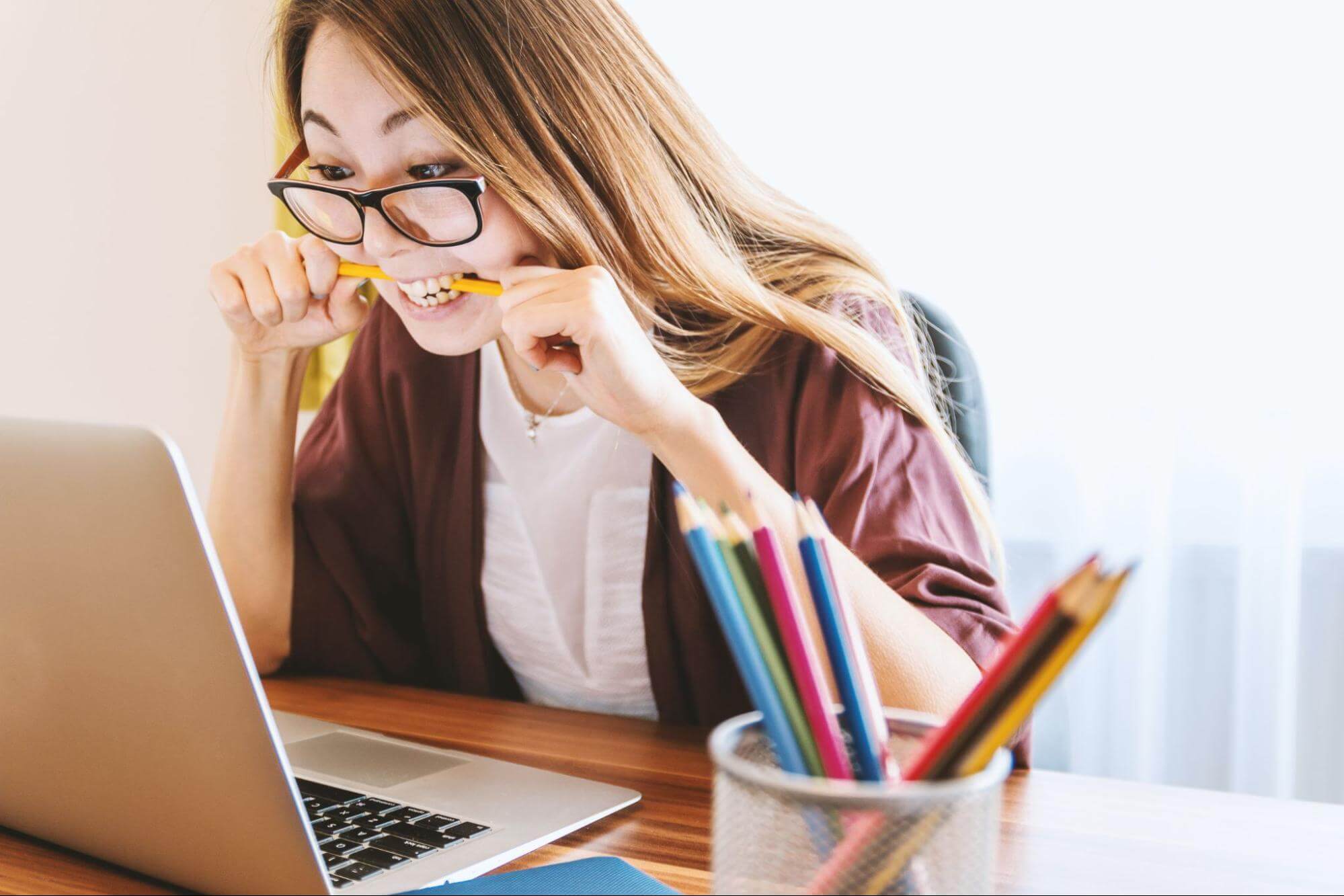 Woman working on laptop.