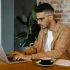 male typing on laptop keyboard