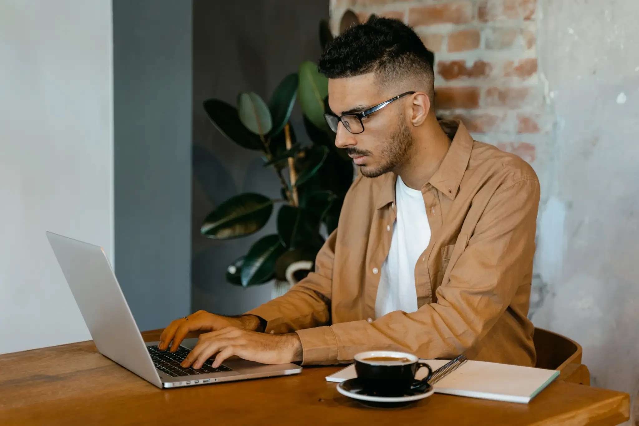 male typing on laptop keyboard