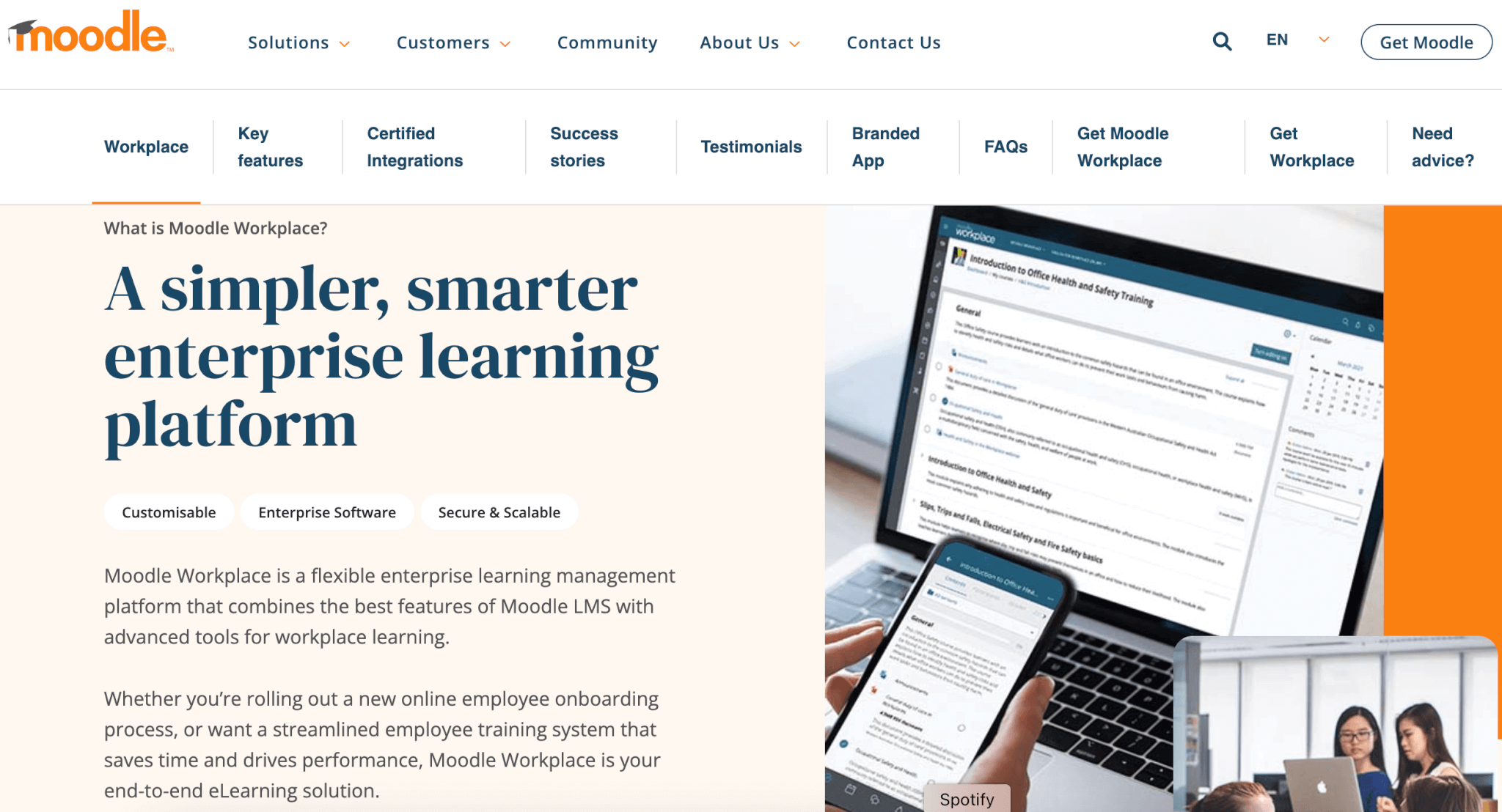 an image of Moodle LMS showing a laptop, a mobile phone, and some people working on a laptop