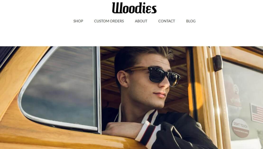 A screenshot of dropshipper and founder of Woodies Cory Stout inside a yellow car wearing sunglasses.