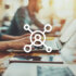 A visual showing a centered person icon with a blurry background featuring people working on their laptops while sitting at a desk.