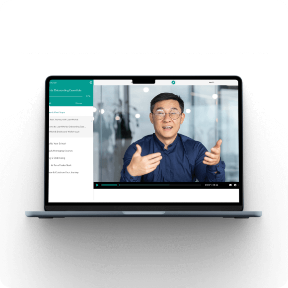 Laptop showing an online course video with an instructor presenting.