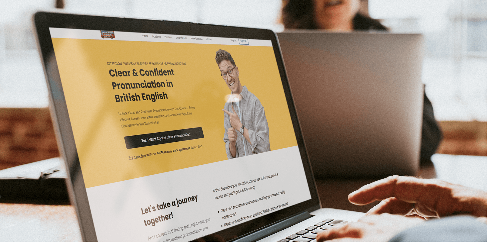 Laptop showing a yellow-themed course website homepage.