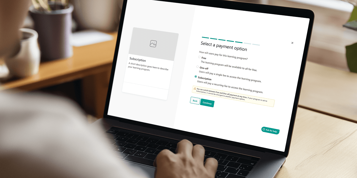 LearnWorlds platform displayed on laptop showing subscription management