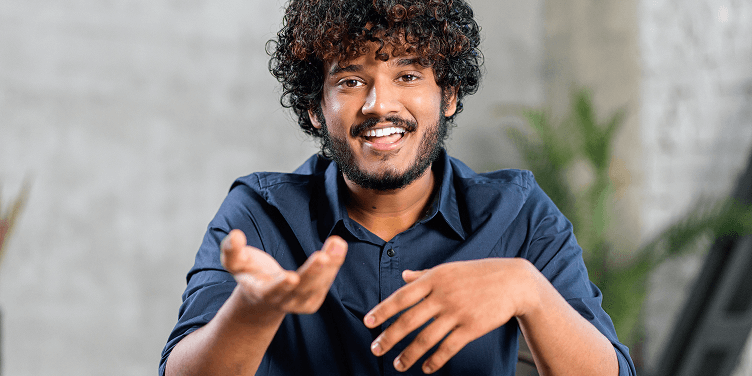 Instructor speaking enthusiastically during an online learning session.